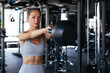 © ty - Image of attractive female doing kettle bell exercise in gym. Fitness woman working out. Crossfit exercise.