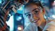 © Johannes - young female worker smiling confident wearing safety goggles using robotic arm at factory