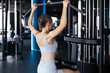 © ty - Attractive sport woman with beautiful figure is engaged in gym. Upper block thrust. Healthy lifestyle.