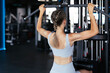 © ty - Attractive sport woman with beautiful figure is engaged in gym. Upper block thrust. Healthy lifestyle.