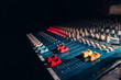 © ADDICTIVE STOCK - Audio Mixing Console With Colorful Controls in Studio Light