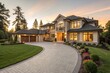 © ShadowStocks - A luxury suburban house with a large driveway, manicured garden, and floor-to-ceiling windows, bathed in warm sunset light