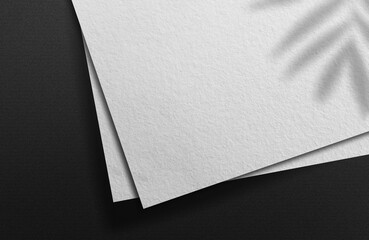 blank paper corner macro view selective focus isolated on different colors as template for logo pres