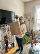 © tessy morelli/Stocksy - UGC Home Portrait with Christmas box