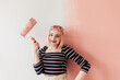 © Melika Tursic/Stocksy - woman posing with pink brush