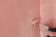 © Melika Tursic/Stocksy - Paint roller on a pink wall