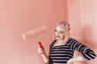 © Melika Tursic/Stocksy - portrait of a happy woman posing with pink brush