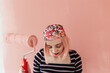 © Melika Tursic/Stocksy - portrait of a happy woman posing with pink brush