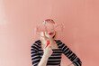 © Melika Tursic/Stocksy - portrait of a happy woman posing with pink brush