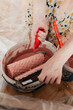 © Melika Tursic/Stocksy - close up of a Woman mixing colors for painting wall at home