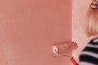 © Melika Tursic/Stocksy - Paint roller on a pink wall