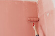 © Melika Tursic/Stocksy - Paint roller on a pink wall