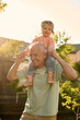 © Iuliia Versta/Stocksy - Grandpa playing with his granddaughter in the backyard