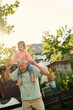 © Iuliia Versta/Stocksy - Grandpa playing with his granddaughter in the backyard