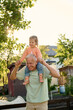 © Iuliia Versta/Stocksy - Grandpa playing with his granddaughter in the backyard