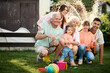 © Iuliia Versta/Stocksy - Family have a fun on a backyard