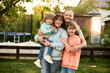 © Iuliia Versta/Stocksy - family portrait on a backyard