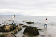 © Tanya Yatsenko/Stocksy - Two sisters on the beach on a cloudy day