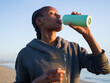 © Milles Studio/Stocksy - Thirsty sportswoman drinking water
