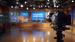 © Maftukhul - Professional video camera on tripod in a television studio set.