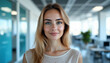 © LensMaster - Portrait of Smiling Woman with Long Brown Hair in Well-Lit Modern Interior Office