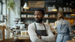 © Lizbond - Small business owner engaging with customers in a cozy coffee shop setting