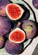 © Ingrid Bertens/Stocksy - Figs with one cut in half