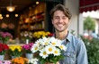 © Lilly - Man holding bouquet of white daisies in a flower shop. Valentines day.
