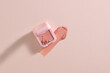 © Marc Tran/Stocksy - A pastel pink blush with a subtle swipe on a minimalist background