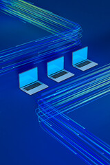 Laptops with data cables on a blue background