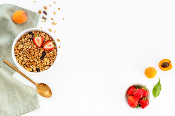 Wall Mural - Bowl of cereal granola with strawberry and honey for breakfast, top view