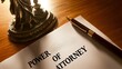 © Sam - Close-up of a power of attorney document with a statue and pen, symbolizing legal authority and trust.