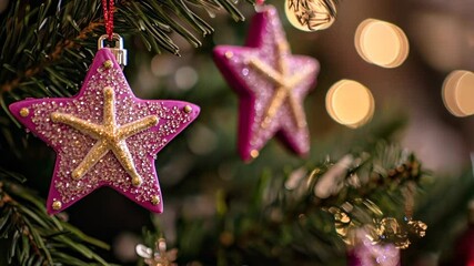 Wall Mural - Sparkling pink star ornaments adorning festive christmas tree branches with twinkling lights