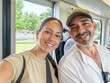 © Lupe Rodriguez/Stocksy - ugc of couple traveling by tram