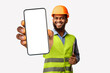 © Prostock-studio - African Construction Workman Giving Instructions Pointing At Camera Holding Pen Standing On White Studio Background. Panorama