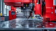 © siyons - Close-up of a red industrial CNC punching machine in operation, precisely drilling holes in a metal sheet.