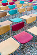 © Ezequiel Giménez/Stocksy - Vibrant Chairs Arranged on Cobblestone