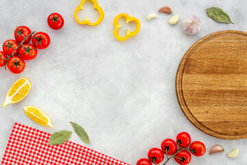 Wall Mural - Cooking layout with wooden cutting board and vegetables. Menu concept