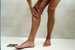 © Guille Faingold/Stocksy - Woman Applying Lotion After a Shower at Home
