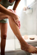 © Guille Faingold/Stocksy - Applying Skin Care Lotion in a Bright Bathroom