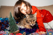 © Gemma can fly/Stocksy - Happy Child and Cat celebrating Christmas