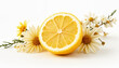 © Tatiana - Halved lemon with daisies on a white background