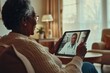 © CreativeLight - An elderly Black man holds a smartphone showing a virtual consultation with an older Black male doctor in a white coat. The image reflects modern telemedicine