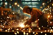 © Thanapong - Industrial factory worker in protective gear welding sparks in a vibrant workshop environment captured from a dynamic perspective for engaging visual content