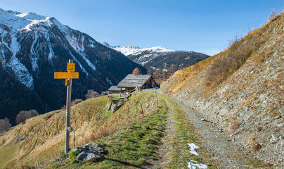 Wall Mural - directional signpost hiking on a trail in the park of Vanoise in the French Alps crossing mountain