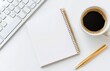 © olegganko - Workspace setup featuring a notepad, coffee cup, and keyboard for creative tasks
