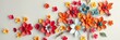 © Chalermrach - Abstract colorful paper flowers in various sizes and shades create a vibrant and eye-catching wall decor Perfect for autumn greeting cards or floral backgrounds, floral, vibrant