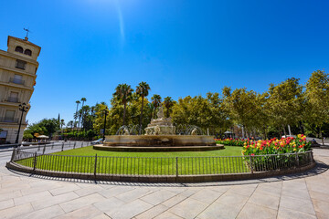 Wall Mural - Seville, Spain - August 01, 2024: Hispalis Fountain on Puerta de Jerez Square in Seville, Spain. 