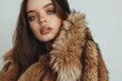 © darshika - Winter luxury fur coat fashion model posing in store.