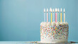 © Mustafa Kawa - Birthday cake decorated with colourful sprinkles and colourful candles, birthday background